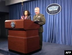 Pentagon spokeswoman Dana White and Marine Lt. Gen. Kenneth McKenzie Jr. brief the media at the Pentagon in this April 5, 2018 photo in Washington, D.C.