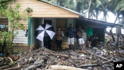 A home is surrounded by debris brought in by Hurricane Irma in Nagua, Dominican Republic, Sept. 7, 2017.