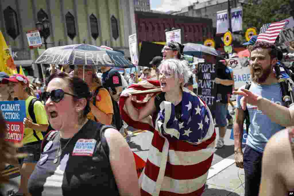 Protesters yell during a demonstration in downtown Philadelphia, July 24, 2016.