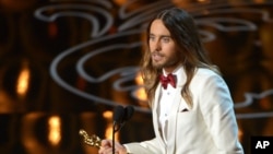 FILE - Jared Leto accepts the award for best actor in a supporting role for “Dallas Buyers Club” during the Oscars at the Dolby Theatre on March 2, 2014.