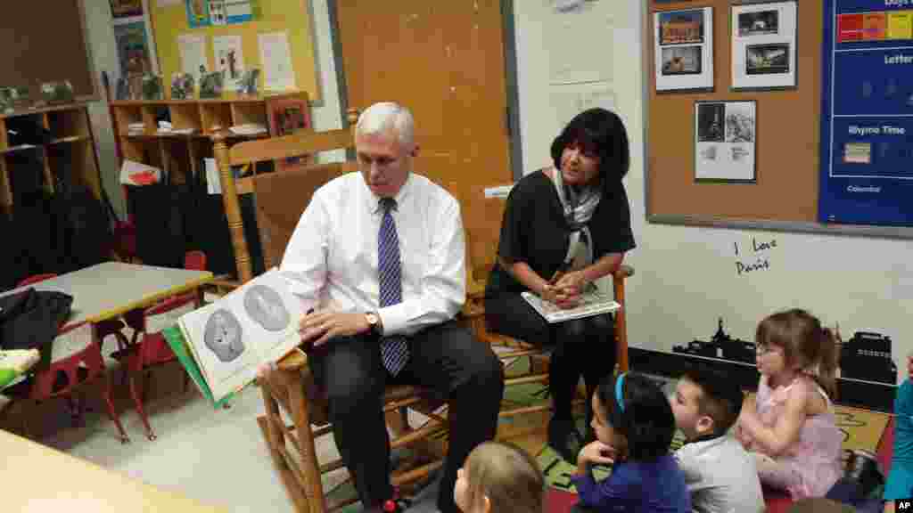 Gov. Mike Pence and First Lady Karen Pence read to children at the Day Nursery daycare in Indianapolis, March 3, 2014.
