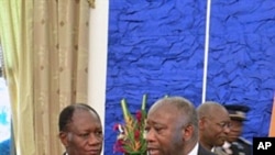 A file photo of Ivory Coast's President Laurent Gbagbo and former PM Alassane Outtara speaking after attending a meeting on 21 Sep 2010 in Ouagadougou