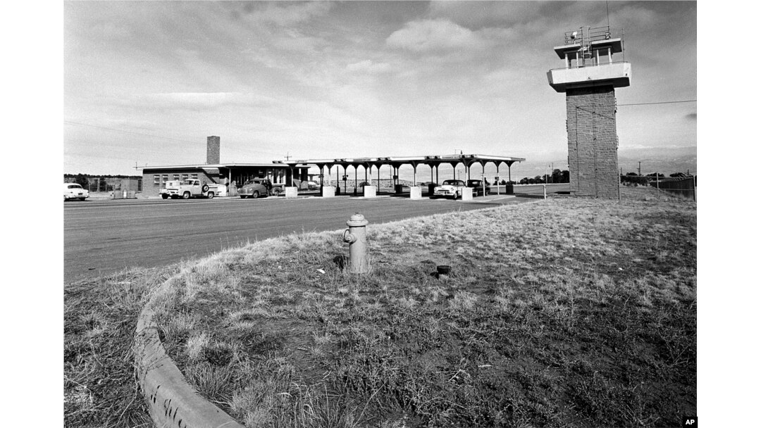 FILE - A photo shows the main gate to the Los Alamos National Laboratory in New Mexico, Feb. 25, 1955.