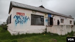 Across South Africa's Eastern Cape - home to Nelson Mandela's boyhood village of Qunu - shops and houses are painted with his nickname "Madiba" and blurred by heavy rains, which in his culture means a great man has passed. (Hannah McNeish for VOA)