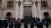 Catalan Mossos d'Esquadra officers carry a protestor as they block TSJC (Superior Court of Justice of Catalonia) during a protest called by the 'Commitees in defence of the Republic' in Barcelona, Spain, Friday, Feb. 23, 2018. 