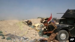 Les forces antiterroristes irakiennes affrontent des militants de l'Etat islamique dans le quartier Nuaimiya de Fallujah, en Irak, mercredi 1er Juin 2016.