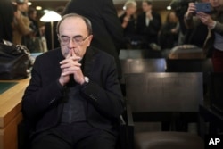 Cardinal Philippe Barbarin waits for the start of his trial at the Lyon courthouse, central France, Jan. 7, 2019.
