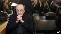 Cardinal Philippe Barbarin waits for the start of his trial at the Lyon courthouse, central France, Jan. 7, 2019.