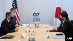 FILE - U.S. Secretary of State Antony Blinken, left, and Japan's Foreign Minister Yoshimasa Hayashi, right, hold a bilateral meeting at the G-7 foreign ministers summit in Liverpool, northwest England, Dec. 11, 2021. 