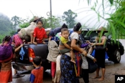 FILE - Karen civilians flee their villages, seeking refuge in Thailand, during an earlier wave of violence.