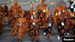 Cameroon's athletes march on the parade during the opening ceremony of the London 2012 Olympic Games, at the Olympic Stadium, July 27, 2012.