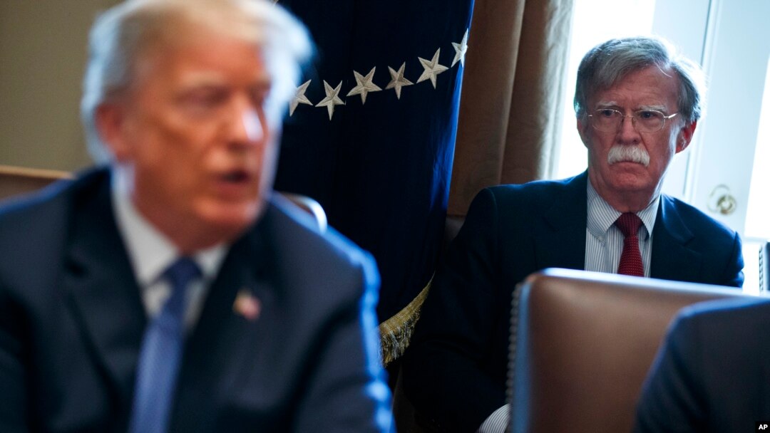 FILE - National security adviser John Bolton listens as President Donald Trump speaks during a cabinet meeting at the White House in Washington, April 9, 2018.
