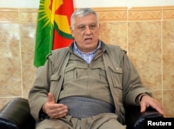 FILE - Cemil Bayik, a founding member of the Kurdistan Workers Party (PKK), is interviewed in the Qandil mountains near the Iraq-Turkey border, Oct.19, 2013.