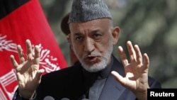 Afghan President Hamid Karzai speaks during a news conference in Kabul (file photo).