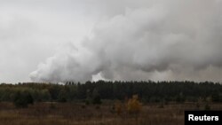 Smoke rises after a fire and explosions hit the Ukrainian defense ministry ammunition depot in the eastern Chernihiv region, Ukraine October 9, 2018.