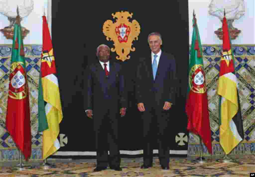Mozambique's President Armando Guebuza, left, poses for a photograph with his Portuguese counterpart Anibal Cavaco Silva Monday, Nov. 28, 2011 at the Belem presidential palace in Lisbon. Guebuza arrived to Portugal for a two-days official visit. (AP Photo