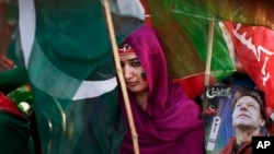 Pakistani supporter of former cricket star-turned-politician, Imran Khan, takes part in rally, Islamabad, May 9, 2013.