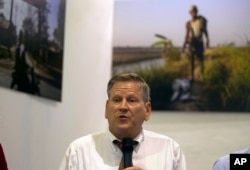 Phil Robertson, deputy Asia director at Human Rights Watch, talks to journalists during a press briefing on a project titled "Nothing for Our Land," July 17, 2018, in Yangon, Myanmar.