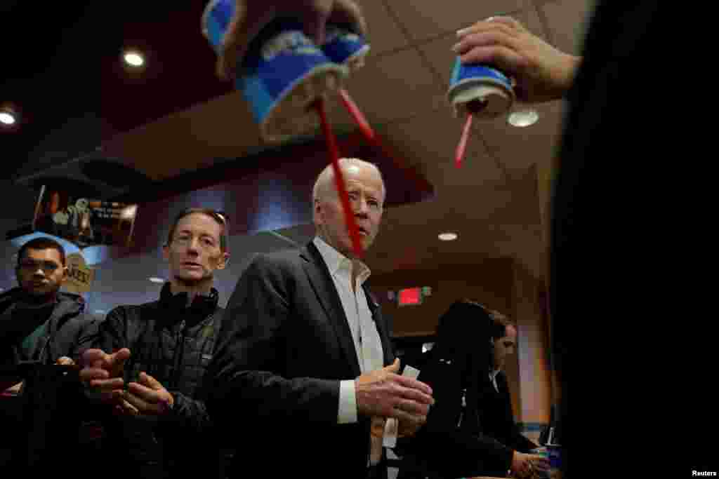 Democratic 2020 U.S. presidential candidate and former Vice President Joe Biden buys ice-cream at a fast food restaurant in Pella, Iowa, Jan. 30, 2020.