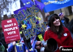 An anti-Brexit protester demonstrates outside the Houses of Parliament, ahead of a vote on Prime Minister Theresa May's Brexit deal, in London, Britain Jan. 15, 2019.