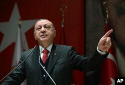 FILE - Turkey's President Recep Tayyip Erdogan addresses his ruling party's provincial leaders in Ankara, Nov. 17, 2017.