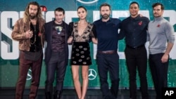FILE - This Nov. 3, 2017 file photo shows "Justice League" cast members Jason Momoa, from left, Ezra Miller, Gal Gadot, Ben Affleck, Ray Fisher and Henry Cavill at a photo call for the film in London.