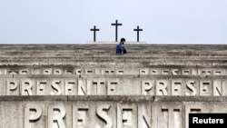 People walk at the Redipuglia Military Sacrarium, Italy, Sept. 12, 2014. 