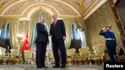 Russian President Vladimir Putin, left, shakes hands with Turkey's President Recep Tayyip Erdogan during their meeting in the Kremlin in Moscow, March 10, 2017.