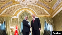 Russian President Vladimir Putin, left, shakes hands with Turkey's President Recep Tayyip Erdogan during their meeting in the Kremlin in Moscow, March 10, 2017.