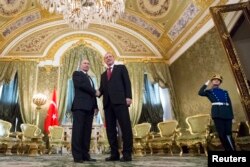 FILE - Russian President Vladimir Putin, left, shakes hands with Turkey's President Recep Tayyip Erdogan during their meeting in the Kremlin in Moscow, March 10, 2017.