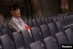 FILE - A veteran watches as U.S. Republican presidential nominee Donald Trump speaks to the Veterans of Foreign Wars conference at a campaign event in Charlotte, North Carolina, July 26, 2016.