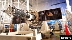 The fully integrated spacecraft and science instrument for NASA's Interface Region Imaging Spectrograph (IRIS) mission is seen in a clean room at the Lockheed Martin Space Systems Sunnyvale, California facility in this undated NASA handout photo.