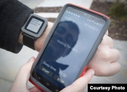 Tyler Skluzacek shows the myBivy smartphone/smartwatch application that helps military veterans suffering from PTSD sleep better at night. (Courtesy photo / T. Skluzacek)