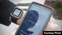 Tyler Skluzacek shows the myBivy smartphone/smartwatch application that helps military veterans suffering from PTSD sleep better at night. (Courtesy photo / T. Skluzacek)