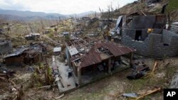 Homes destroyed by Hurricane Matthew stand in Moron, Haiti, Oct. 10, 2016.