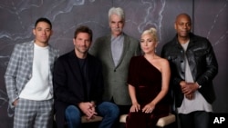 Bradley Cooper, seated left, cast member and director of the film "A Star is Born," poses with actors, from left, Anthony Ramos, Sam Elliott, Lady Gaga and Dave Chappelle at the Four Seasons Hotel during the Toronto International Film Festival.