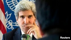 U.S. Secretary of State John Kerry listens to a question during a discussion with Chinese bloggers in Beijing February 15, 2014.