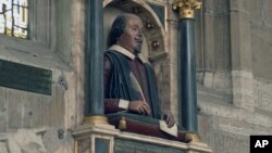 FILE - This April 12, 2016 photos shows a bust of William Shakespeare which sits above the famous British playwright's grave at Holy Trinity Church in Stratford-upon-Avon, England. (AP Photo/James Brooks)