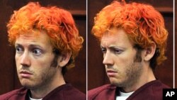 Ekspresi James Holmes saat menghadiri sidang pertamanya di pengadilan wilayah Arapahoe (23/7). 