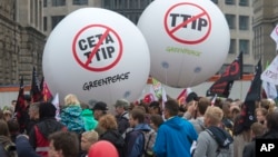 People demonstrate against the TTIP and CETA trade agreements in Leipzig, Germany, Sept. 17, 2016. Thousands of people are rallying in cities across Germany to protest against planned European Union trade deals with the United States and Canada. 
