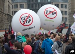 People demonstrate against the TTIP and CETA trade agreements in Leipzig, Germany, Sept. 17, 2016. Thousands of people are rallying in cities across Germany to protest against planned European Union trade deals with the United States and Canada.