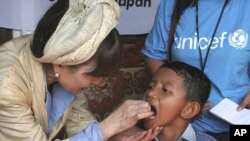 FILE - Renowned Japanese actress Tetsuko Kuroyanagi who is a UNICEF Goodwill Ambassador gives an Indonesian boy a measles vaccination Thursday Feb. 3, 2005 in the remote village of Keudai Tenom on Aceh's West coast.