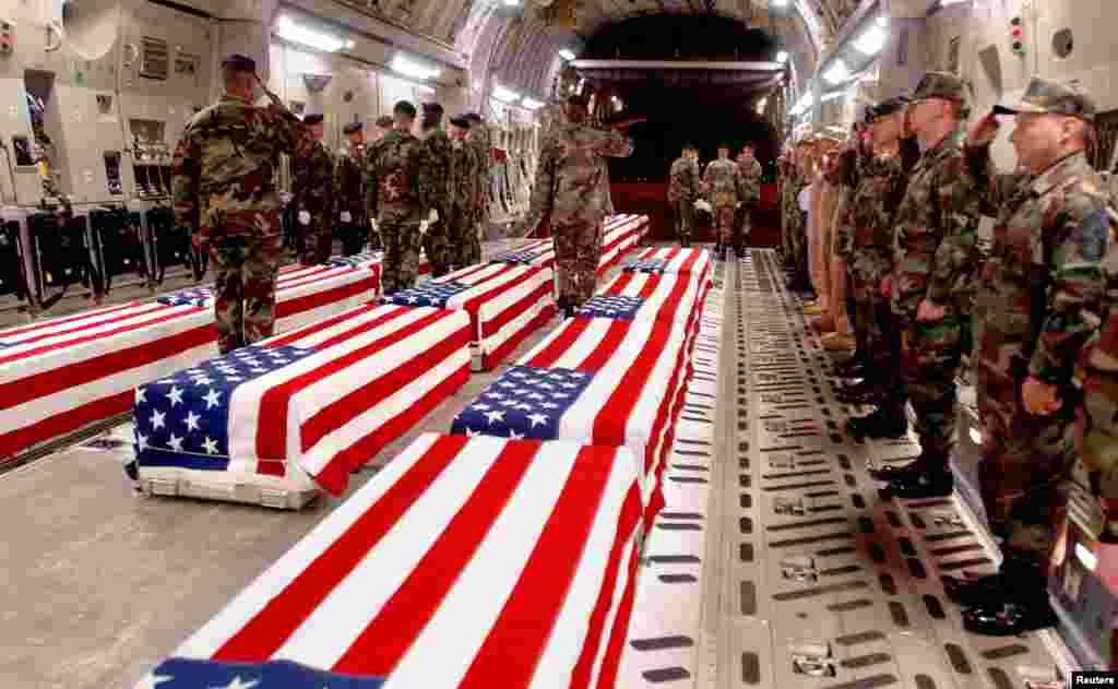 Coffins of U.S. military personnel are prepared to be offloaded at Dover Air Force Base in Dover, Delaware in this undated photo released in 2004.