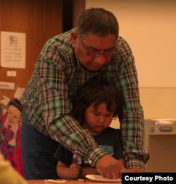 Tom Red Bird teaching Lakota at the Lakȟól'yapi Wahóȟpi Lakota immersion preschool in Fort Yates, ND. Courtesy: Florentine Films/Hott Productions