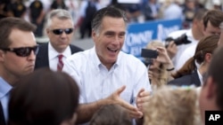 Republican presidential candidate and former Massachusetts Gov. Mitt Romney shakes hands during a campaign event in Hobbs, New Mexico, Aug. 23, 2012.