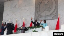 Angola's new president Joao Lourenco waves after being sworn in as the country's first new leader in 38 years in Luanda, Angola, Sept. 26, 2017.