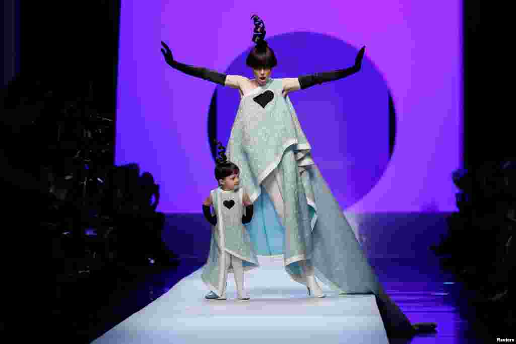 Model Coco Rocha and her daughter present creations by French designer Jean Paul Gaultier as a part of his Haute Couture Spring-Summer 2018 fashion collection in Paris, France.