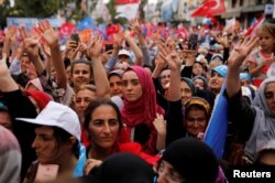 Supporters of Turkish President Recep Tayyip Erdogan attend an election rally in Istanbul, June 23, 2018.