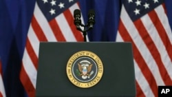 FILE - The U.S. presidential seal is seen on a podium at MacDill Air Force Base, in Tampa, Florida, Dec. 6, 2016.