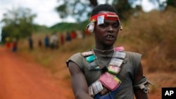 An anti-Balaka Christian militiaman mans a mobile checkpoint near Sibut, some 200kms (140 miles) northeast of Bangui, Central African Republic, Friday April 11, 2014. The U.N. Security Council voted unanimously Thursday to authorize a nearly 12,000-strong